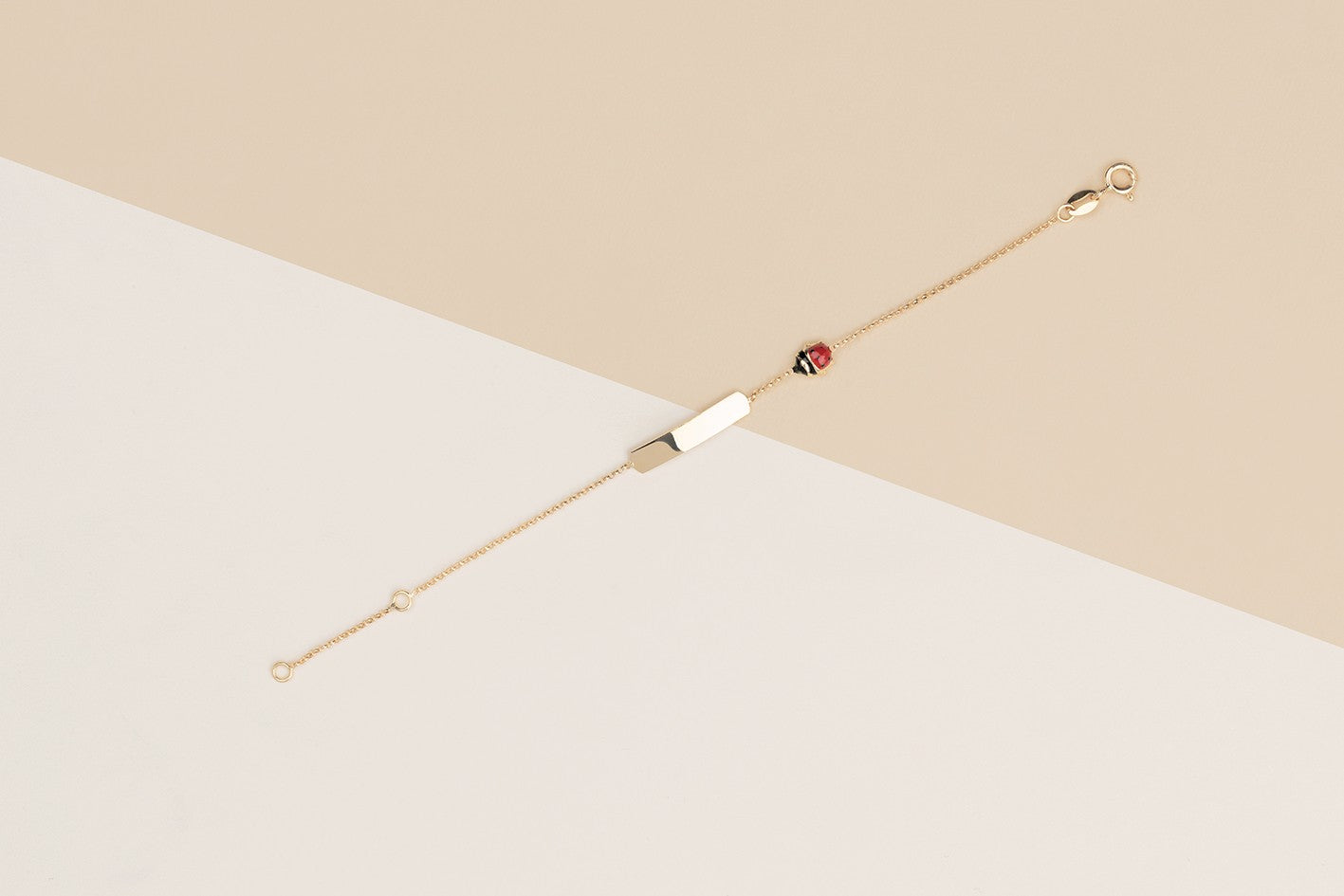Bracciale baby coccinelle e targa oro giallo