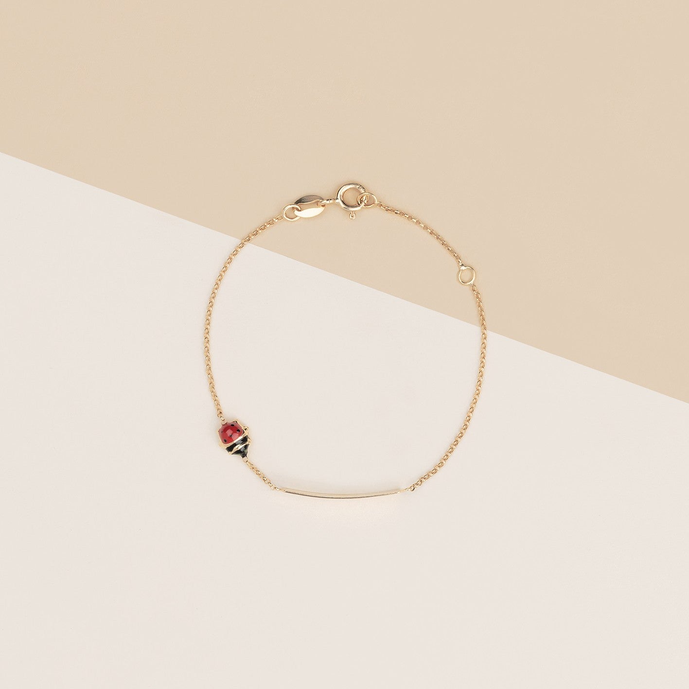 Bracciale baby coccinelle e targa oro giallo