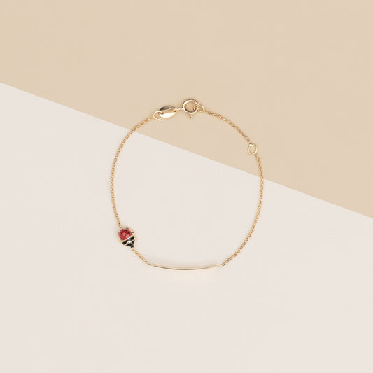 Bracciale baby coccinelle e targa oro giallo