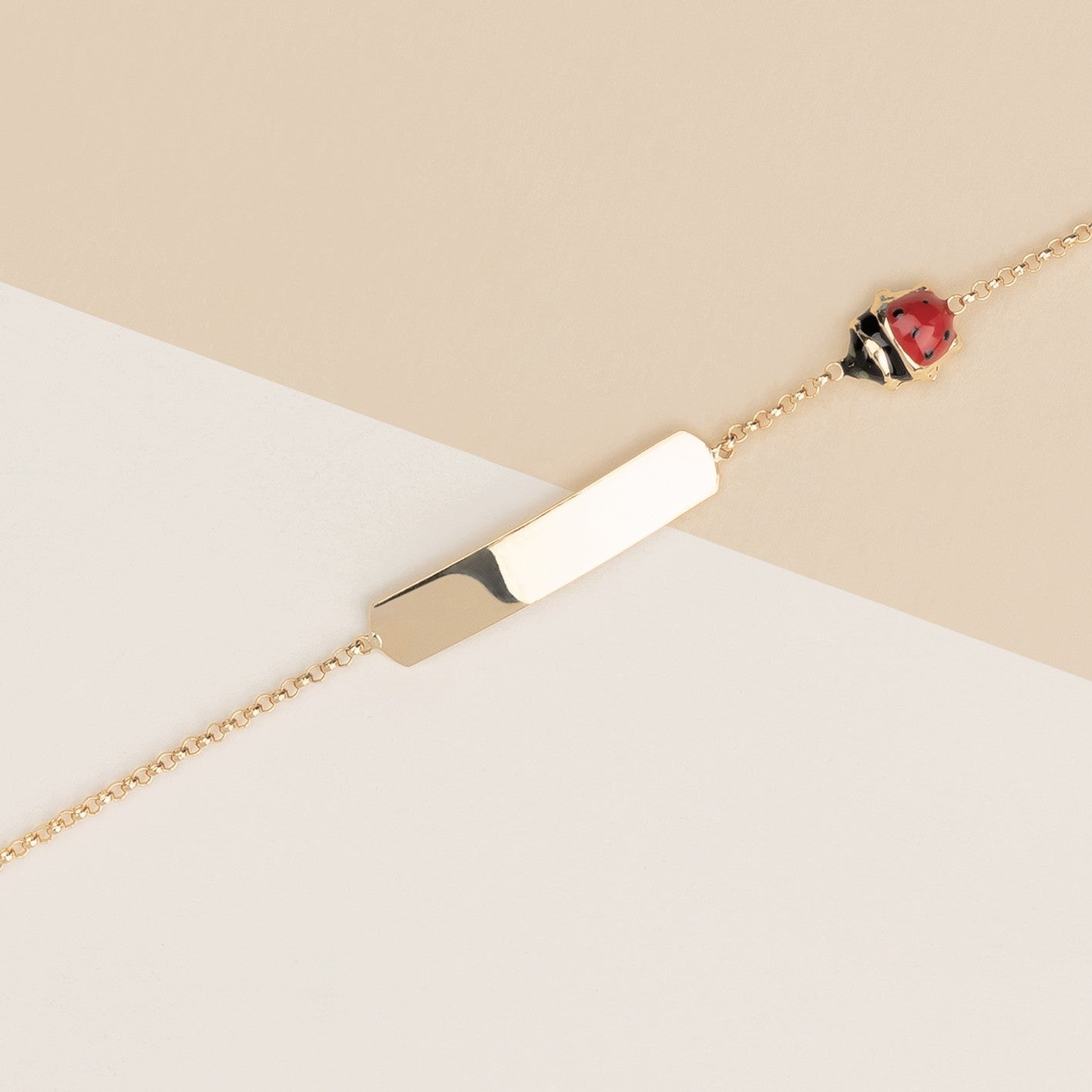 Bracciale baby coccinelle e targa oro giallo