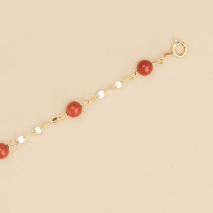 Bracciale baby con corallo rosso e targa oro giallo