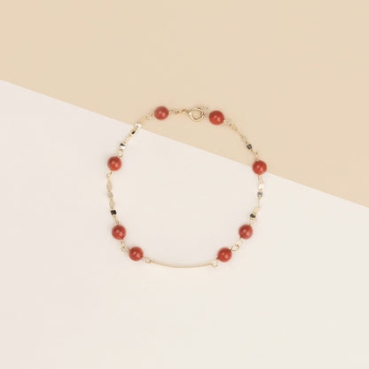 Bracciale baby con corallo rosso e targa oro giallo