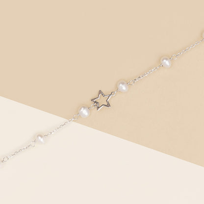 Bracciale baby con perline e stelle in oro bianco