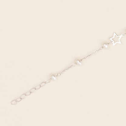 Bracciale baby con perline e stelle in oro bianco
