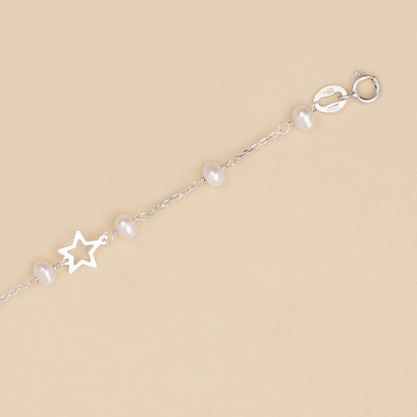 Bracciale baby con perline e stelle in oro bianco
