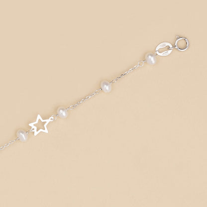 Bracciale baby con perline e stelle in oro bianco