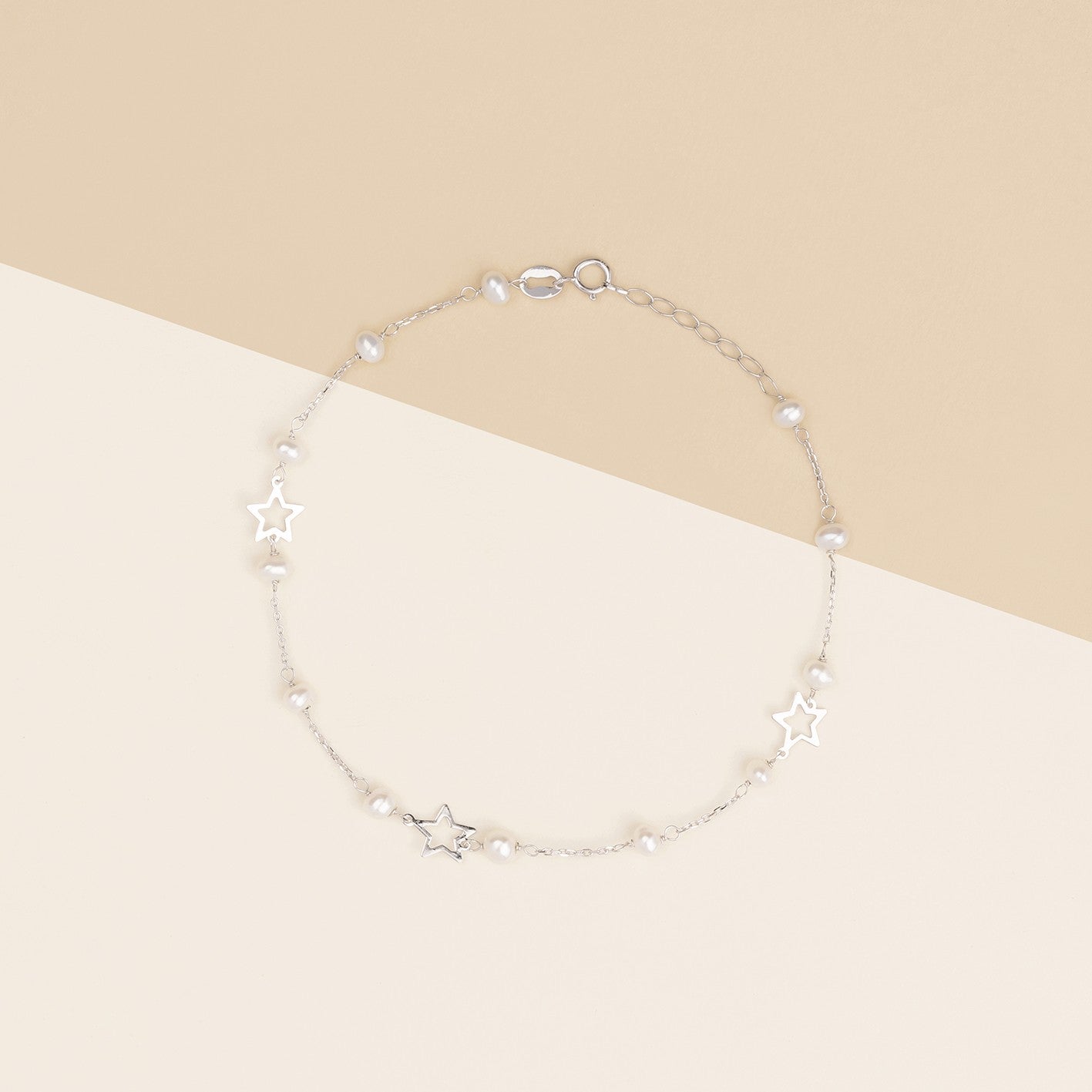 Bracciale baby con perline e stelle in oro bianco