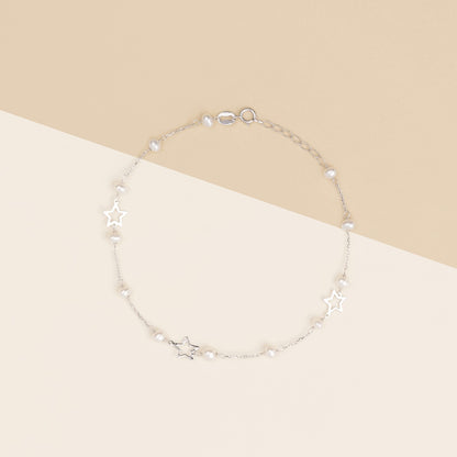 Bracciale baby con perline e stelle in oro bianco