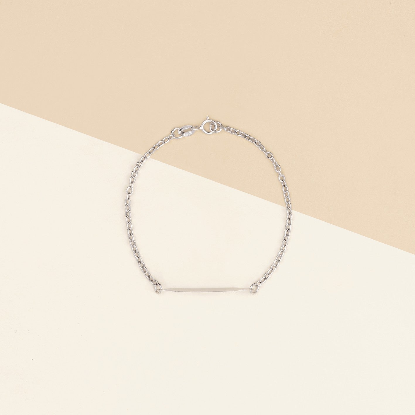 Bracciale baby con targa oro bianco 1.10